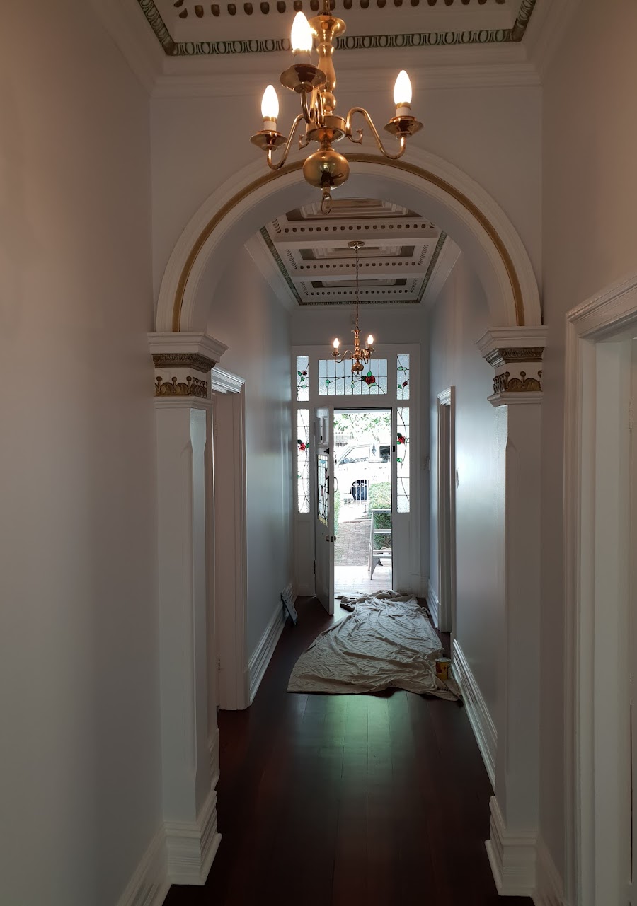 Restored heritage hallway with ornate ceiling painted by Performance Painting