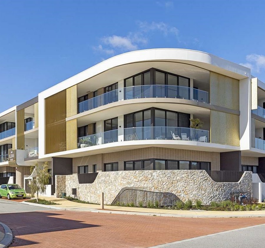 Exterior painting of a modern coastal apartment building